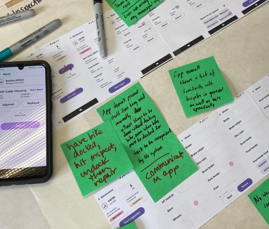 User research with post its and printed out fieldwork app